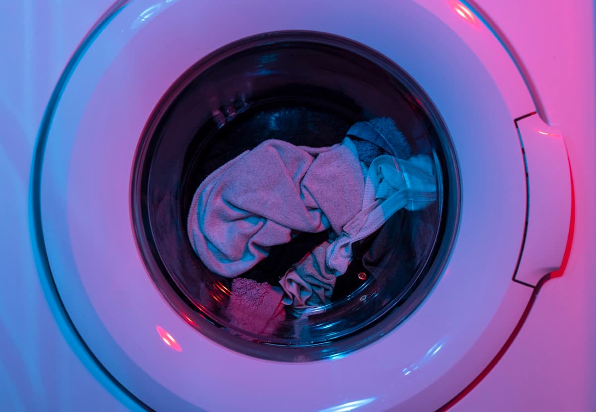 Laundry tumbling inside a front-loading drum