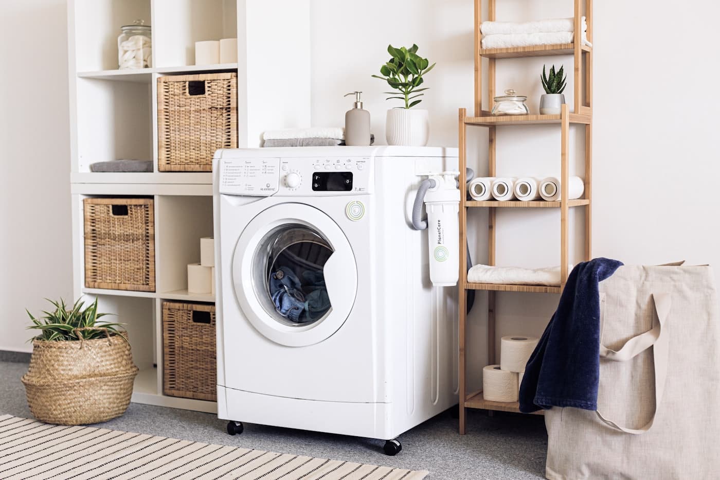 A bright, orderly laundry room with a front-loading machine